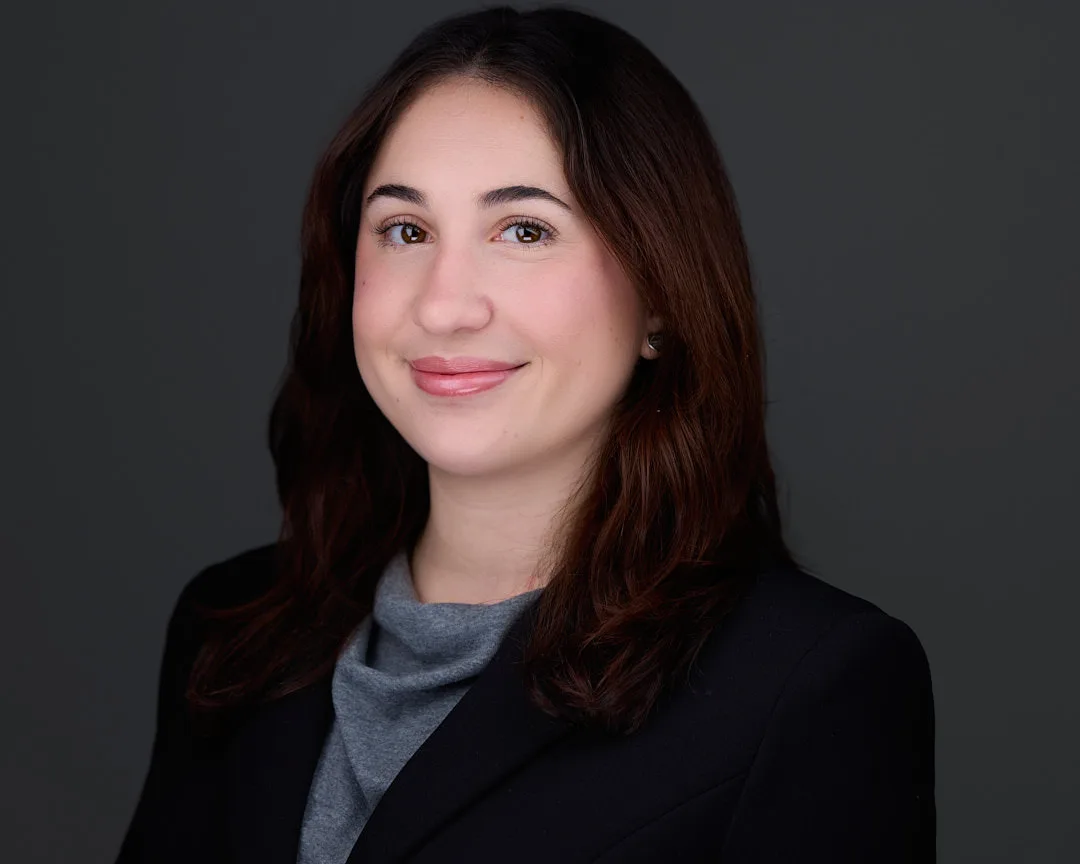 Professional headshot of a Tysons Corner VA professional in a black blazer and gray top