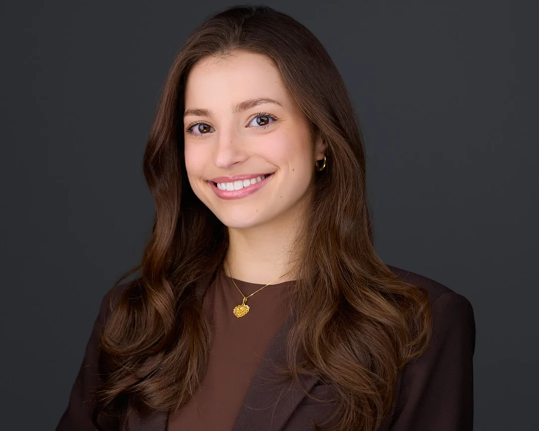 Professional headshot for a Northern Virginia executive with a confident expression in studio lighting