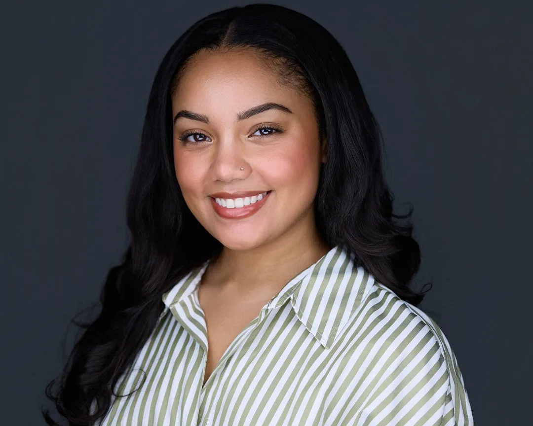 Professional woman in striped shirt smiling