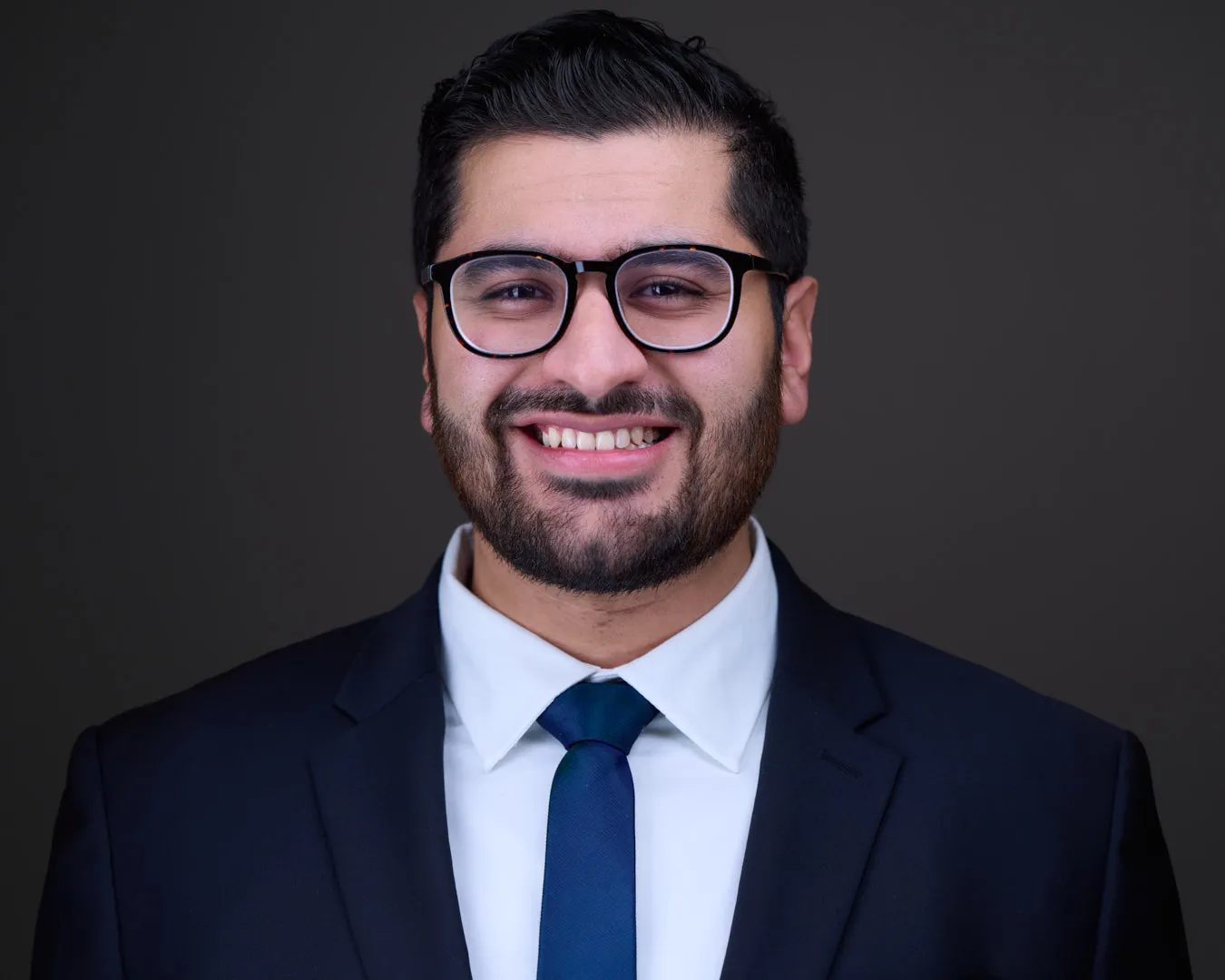 Professional headshot captured during a directed studio session