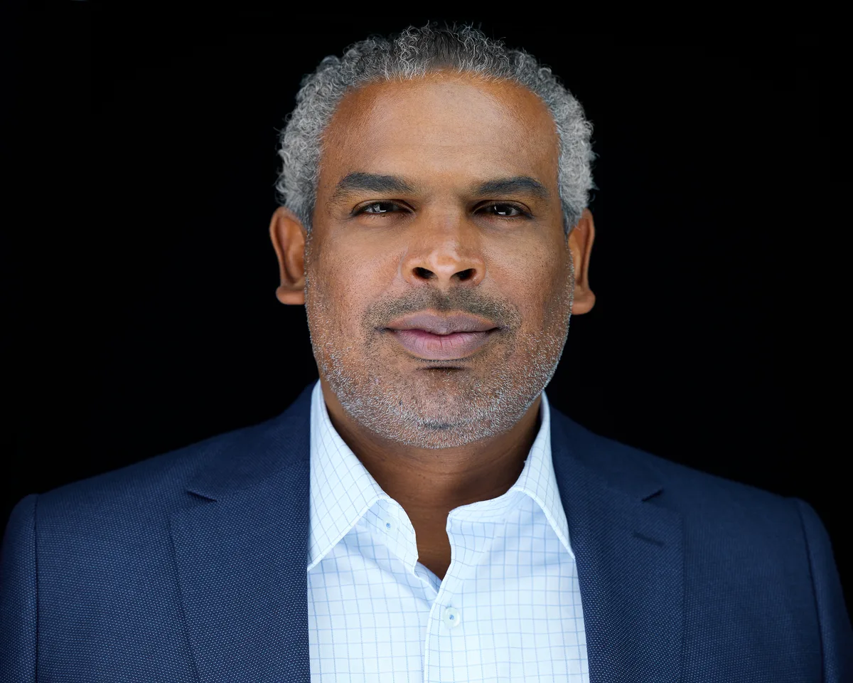 Real estate agent portrait showing the studio lighting and natural retouching that hold up in print
